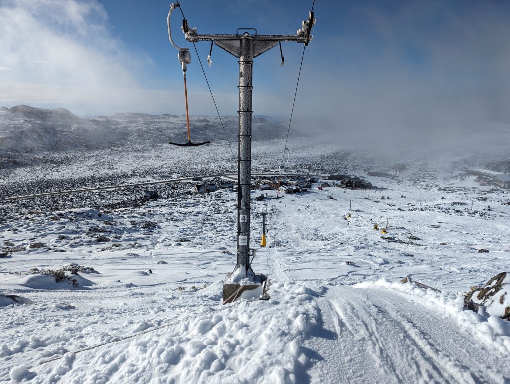 Ski lift surrounded by snow